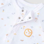 organic baby romper snap button detail close up
