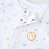 organic baby romper snap button detail close up
