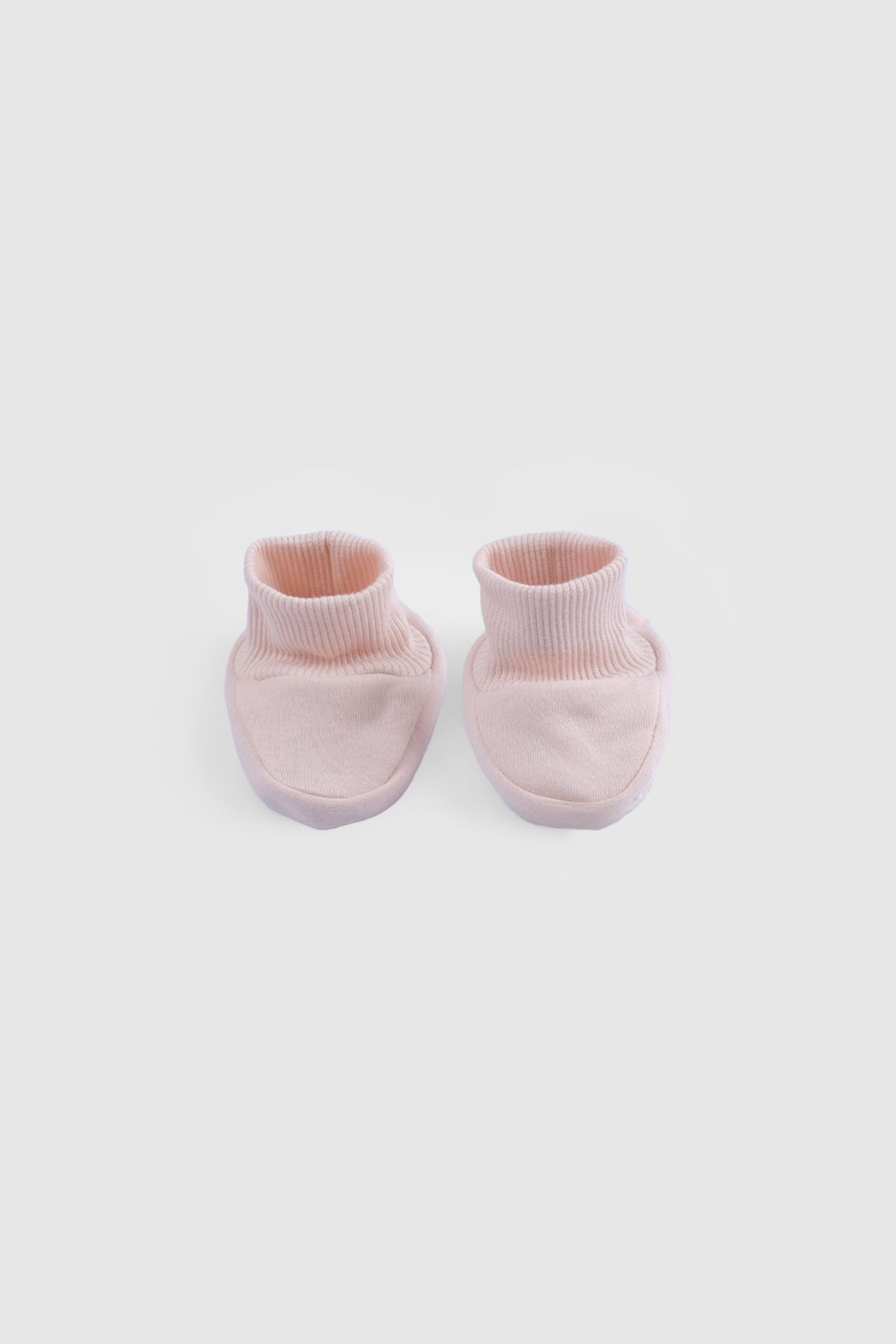 pink newborn booties soft cotton baby socks front view