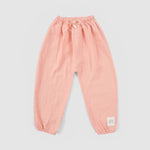 baby girl wearing muslin outfit pink

