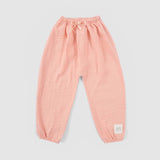 baby girl wearing muslin outfit pink
