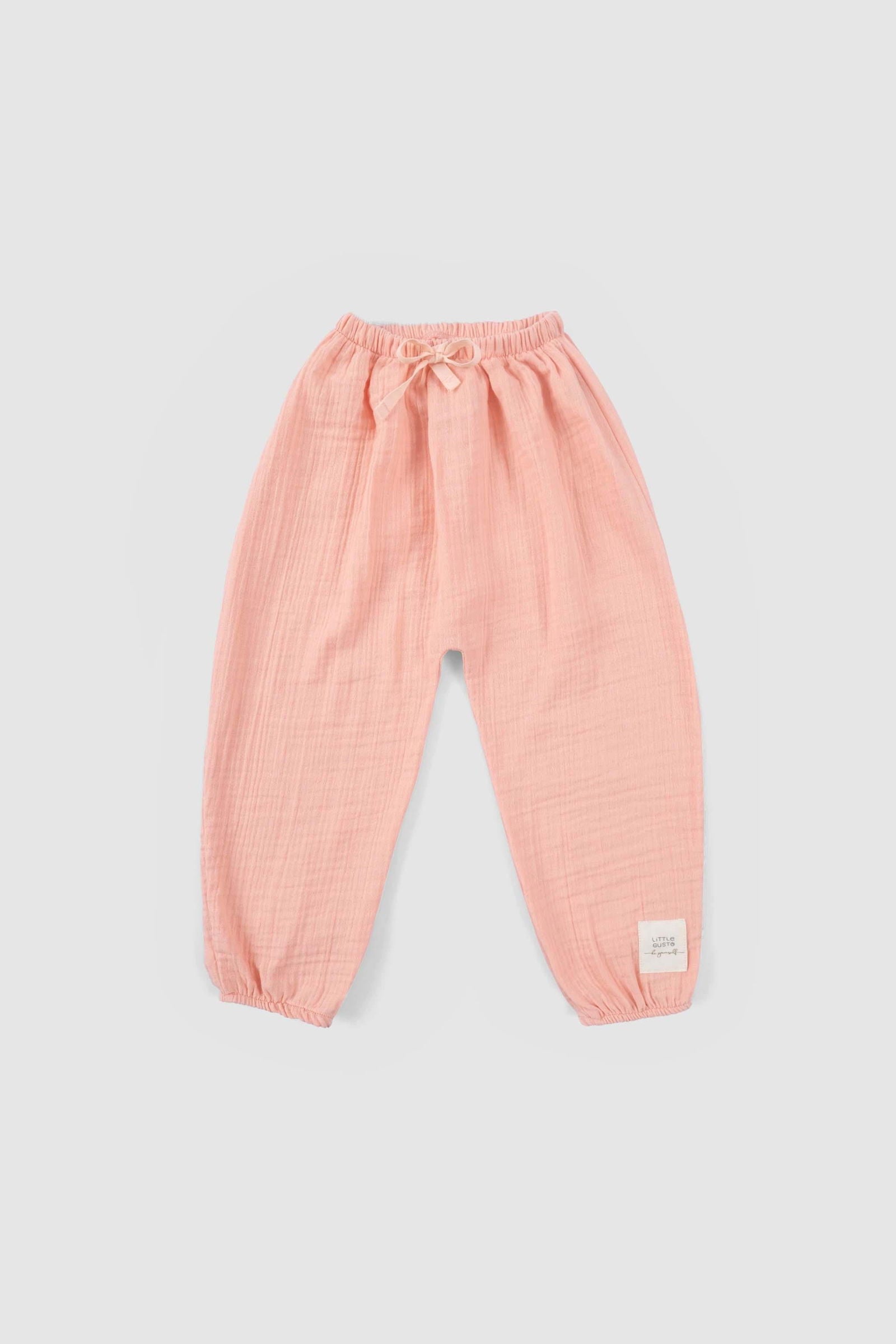 baby girl wearing muslin outfit pink
