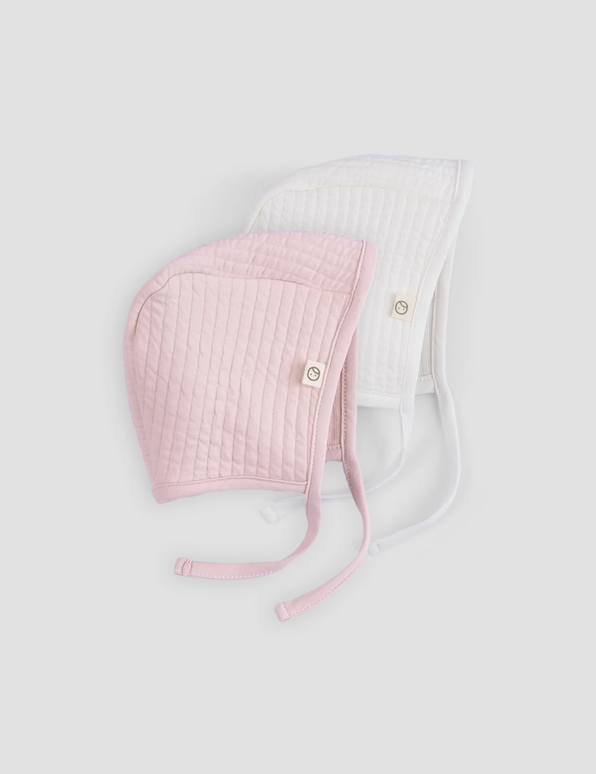 pink and white ribbed baby bonnet organic cotton textured hat detail