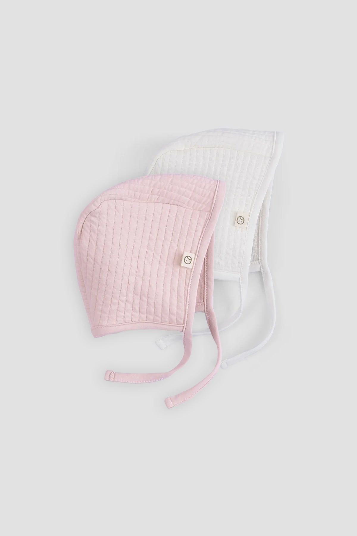 pink and white ribbed baby bonnet organic cotton textured hat detail