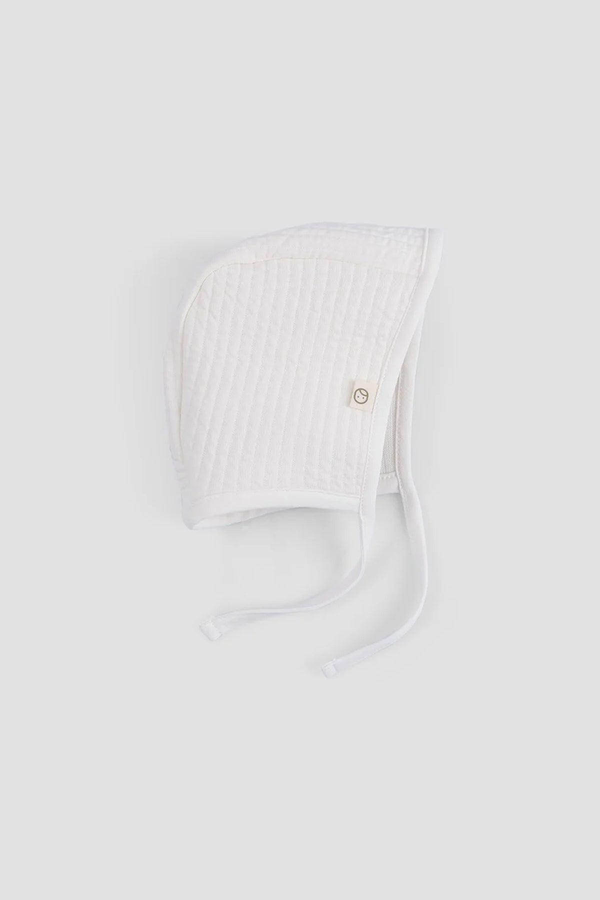white ribbed baby bonnet organic cotton textured hat detail2